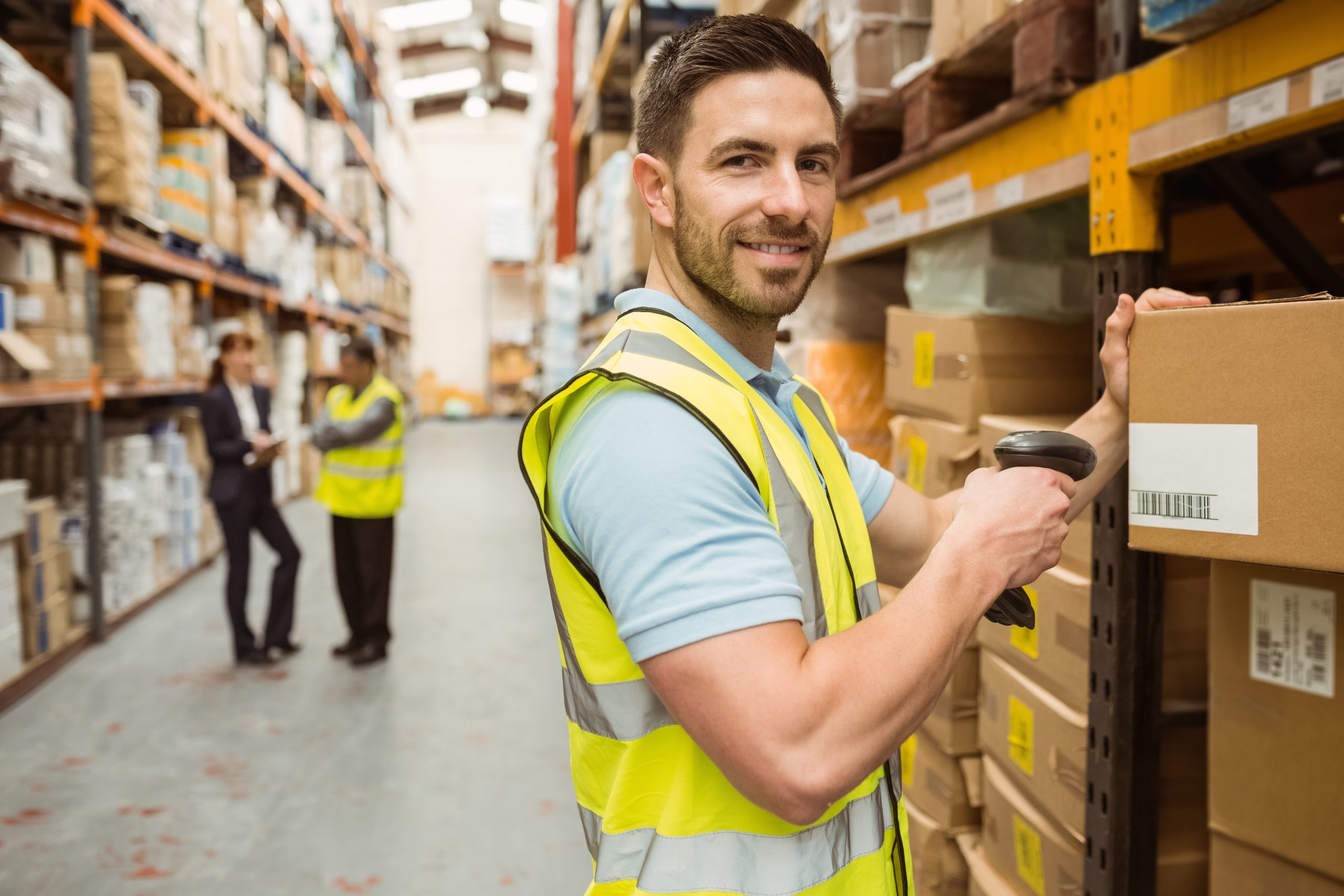 warehouse worker happy because he read the top 10 best tips in inventory management